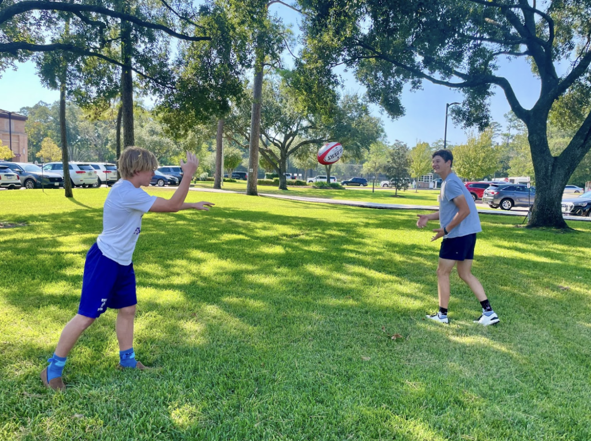 Rugby Club members Morgan Tannery and Jack Harper practice throwing the rugby ball around. Each club day, the Rugby team goes down to the center green to throw around the ball and practice specific skills. Dante, the club president, states that “the club welcomes all students to experience the physical and mental strength rugby builds.” 
